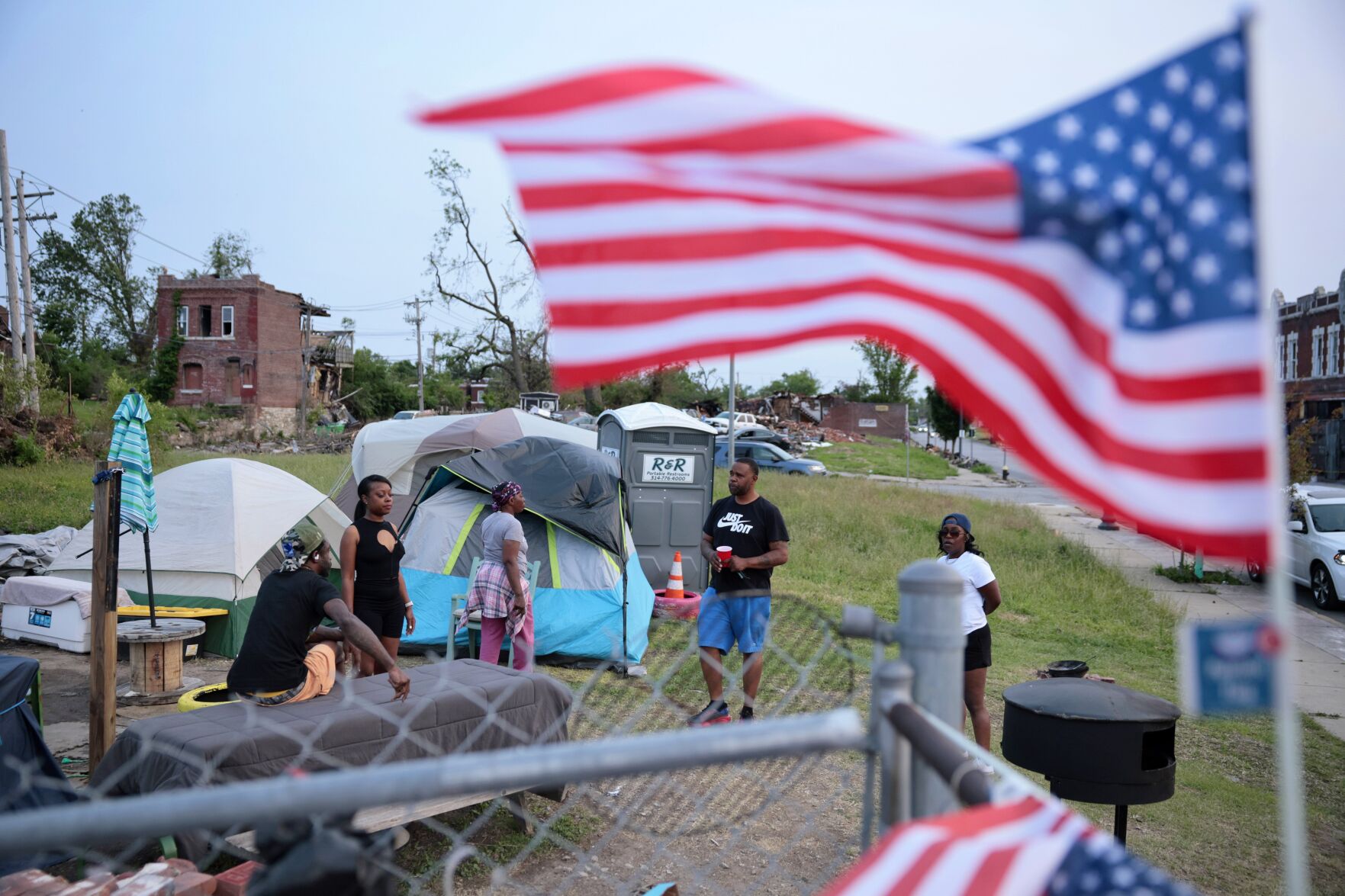 Tornado victims cling to their property, despite the damage